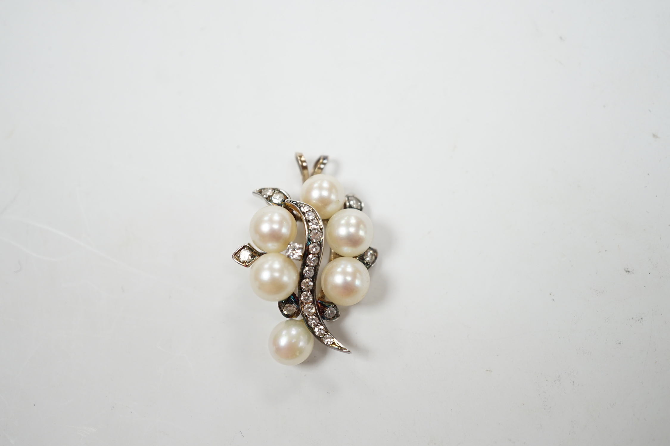 A yellow and white metal, cultured pearl and diamond cluster set spray pendant, 33mm, gross weight 6.1 grams.
